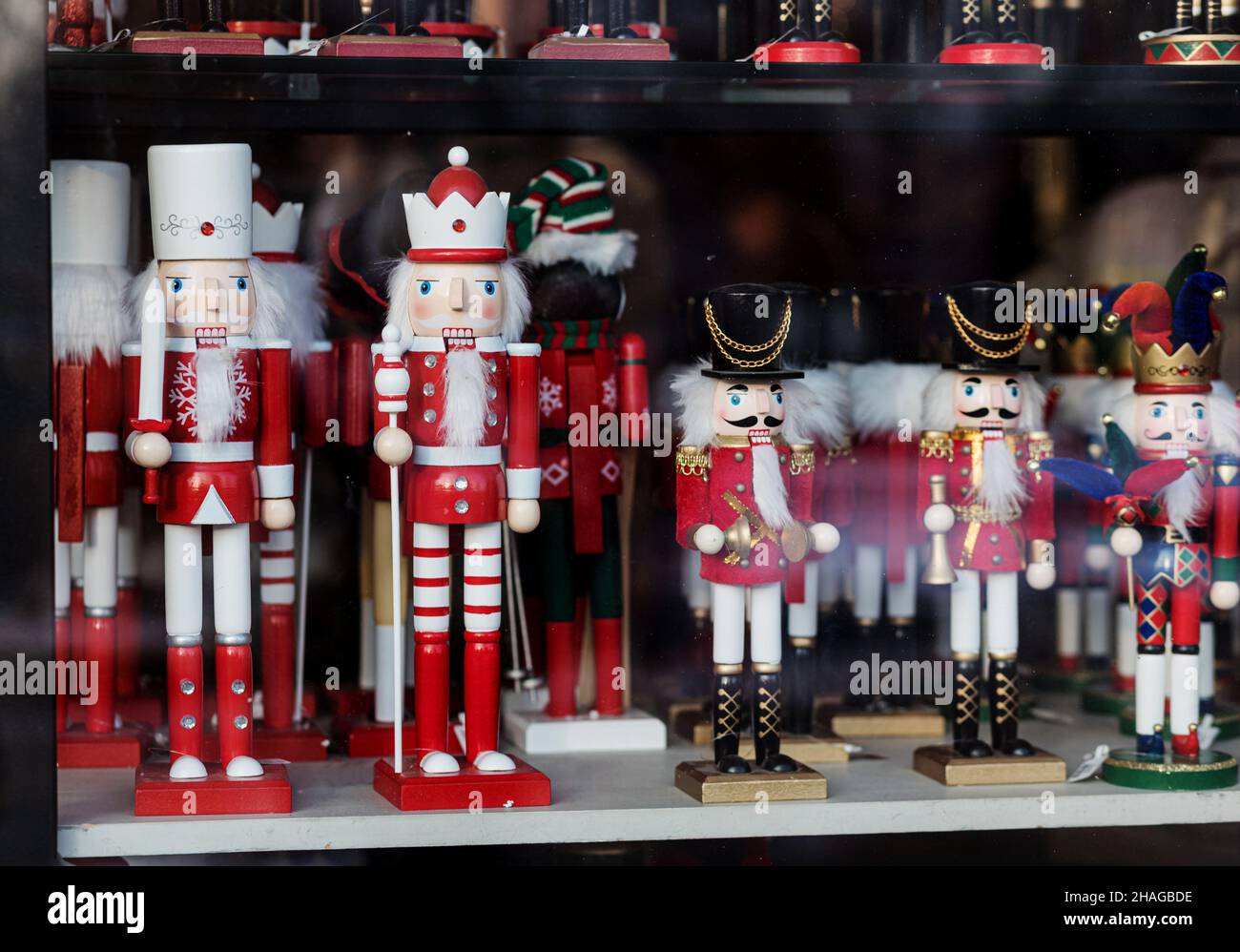 Christmas wooden Nutcracker on the shop window. Festive soldier Stock