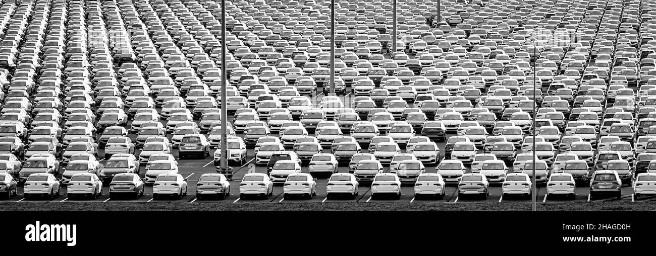 Volkswagen Group Rus, Russia, Kaluga - NOVEMBER 17, 2020: Rows of a new cars parked in a distribution center. Parking in the open air. Monochrome. Stock Photo