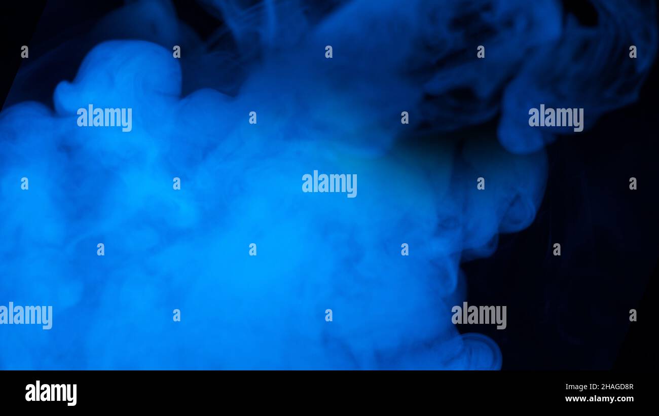 Blue steam on a black background. Copy space. Stock Photo