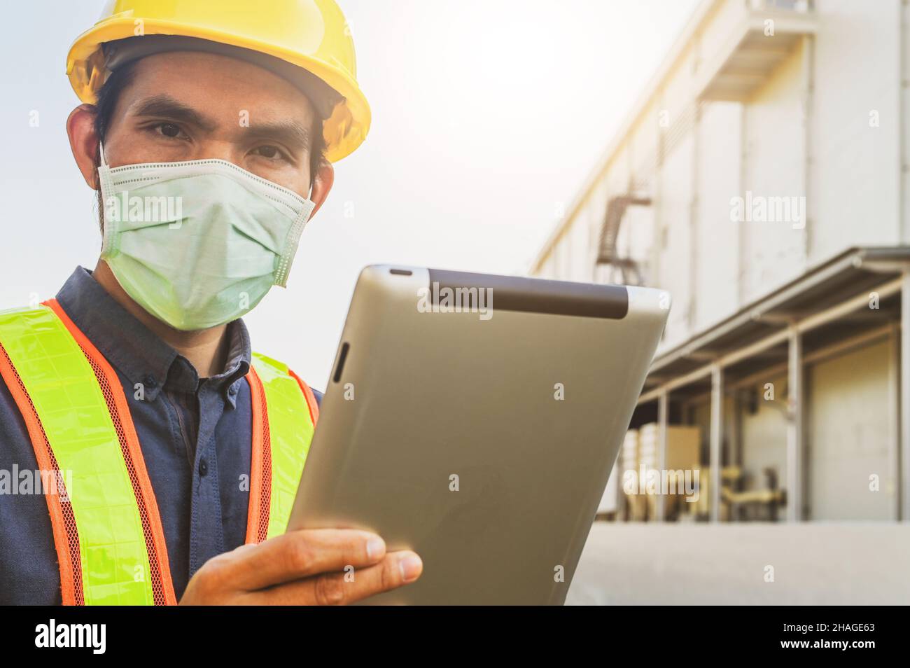 Safety Engineer using tablet inspection efficiency facility manufacturing of factory , Designer architecture engineering, Workplace production control Stock Photo