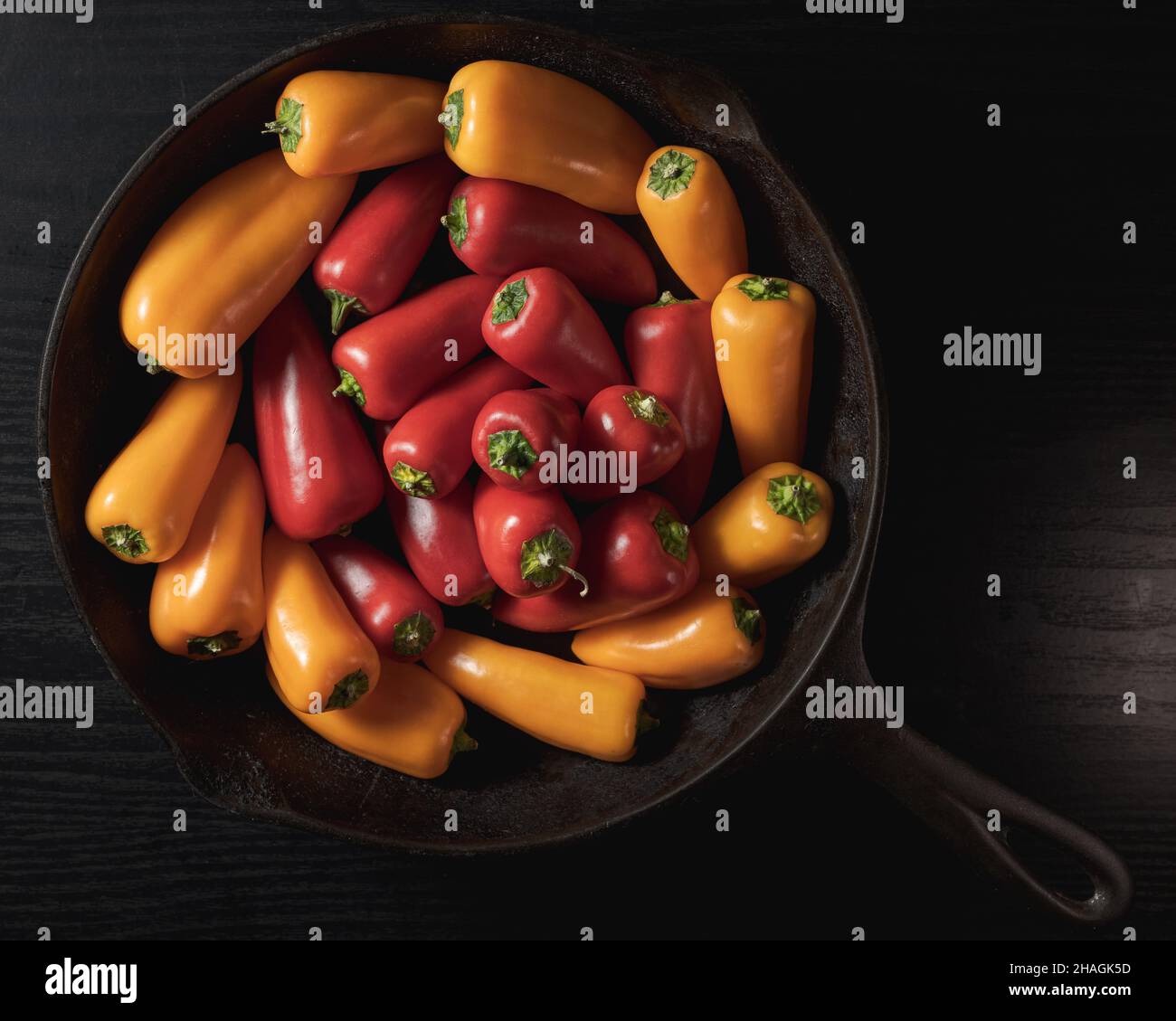 Top view of red and yellow sweet jalapeno peppers on a pan Stock Photo ...
