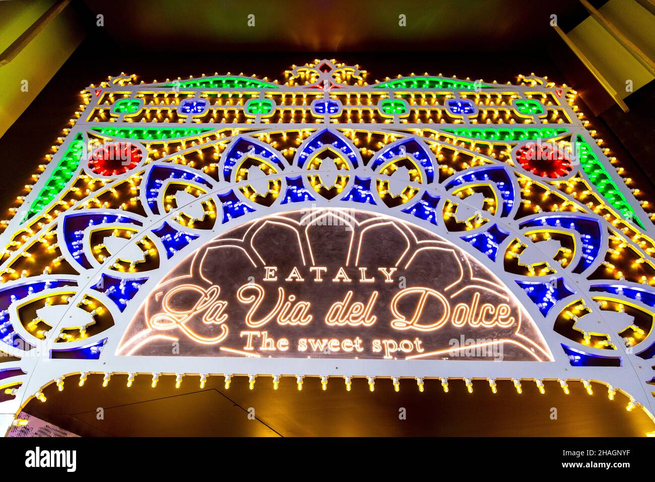 La Via del Dolce decorated with colourful lights at Eataly, London, UK Stock Photo