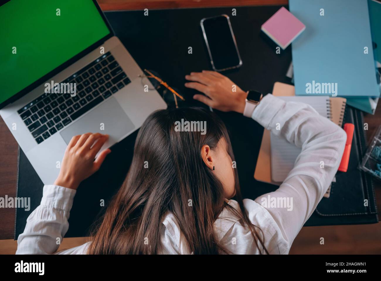 Young beautiful woman fell asleep at her desk Stock Photo - Alamy