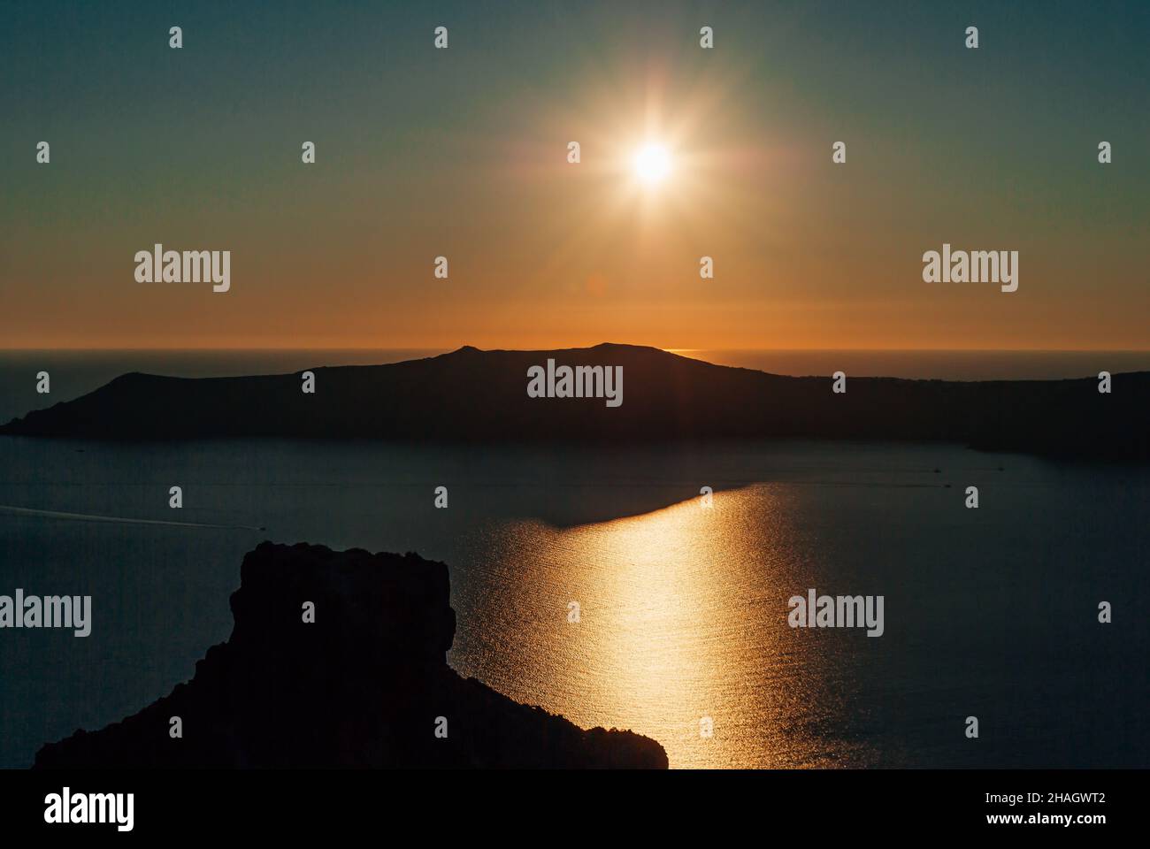 Sunset view over the caldera against the backdrop of the rock of Skaros, Santorini, Greece Stock Photo