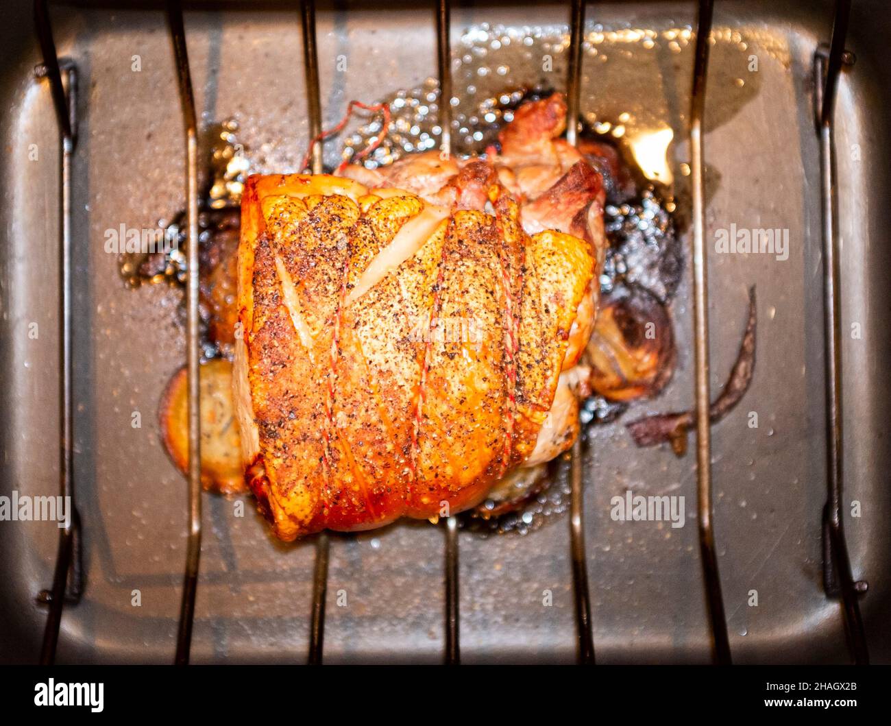 Roast Pork joint with crackling   Photograph taken by Simon Dack Stock Photo