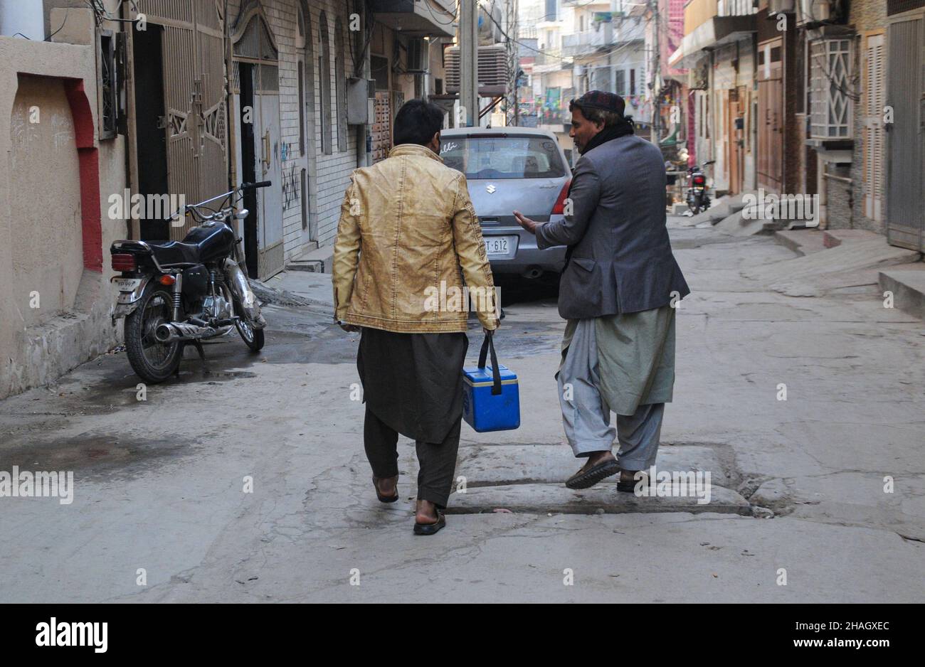 RAWALPINDI, Pakistan - December 13: A health worker administers polio vaccine to a child during an anti-polio drive in Rawalpindi on December 13, 2021 Stock Photo