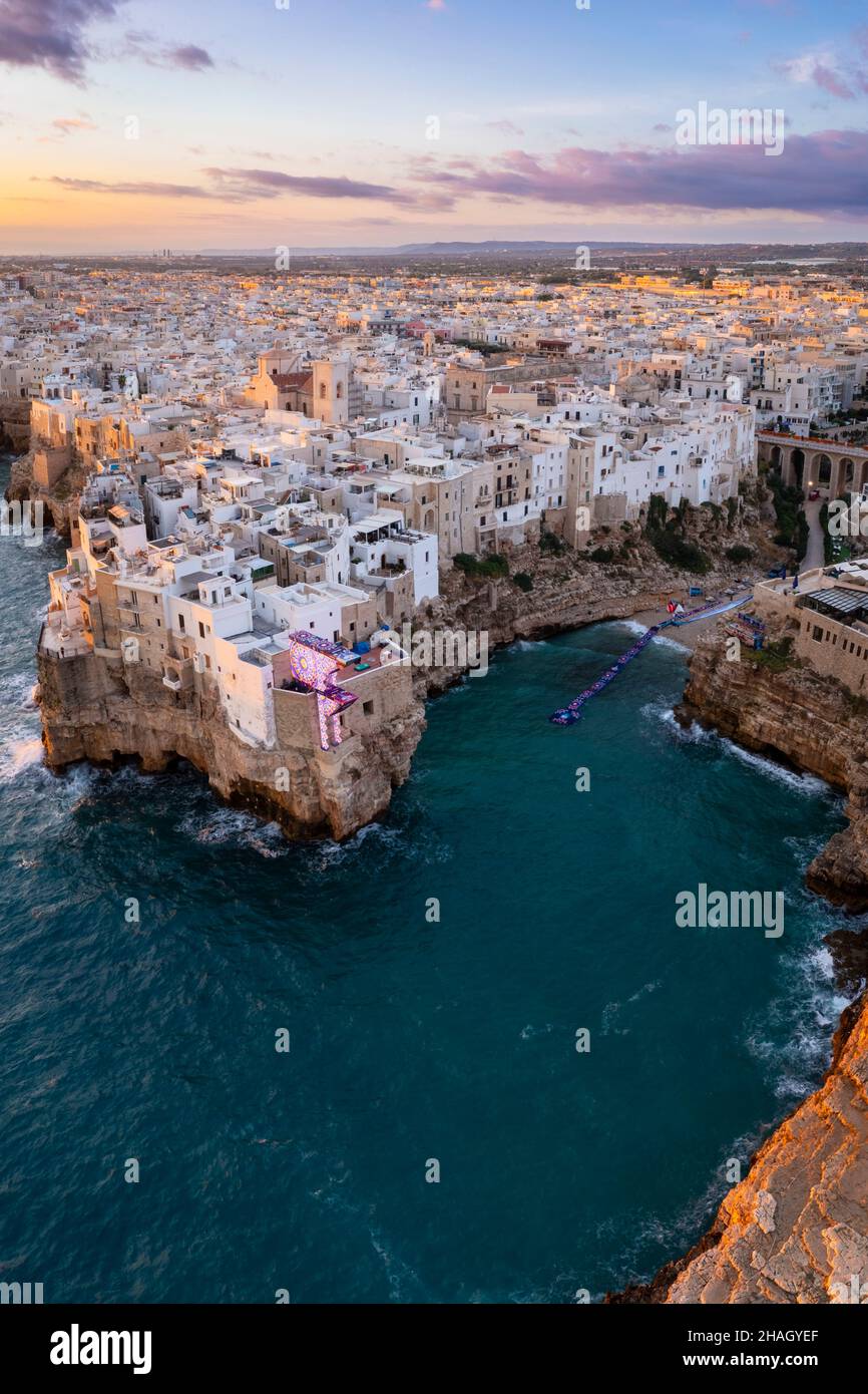 Aerial view of the overhanging houses of Polignano a Mare at sunrise. Bari district, Apulia, Italy, Europe. Stock Photo