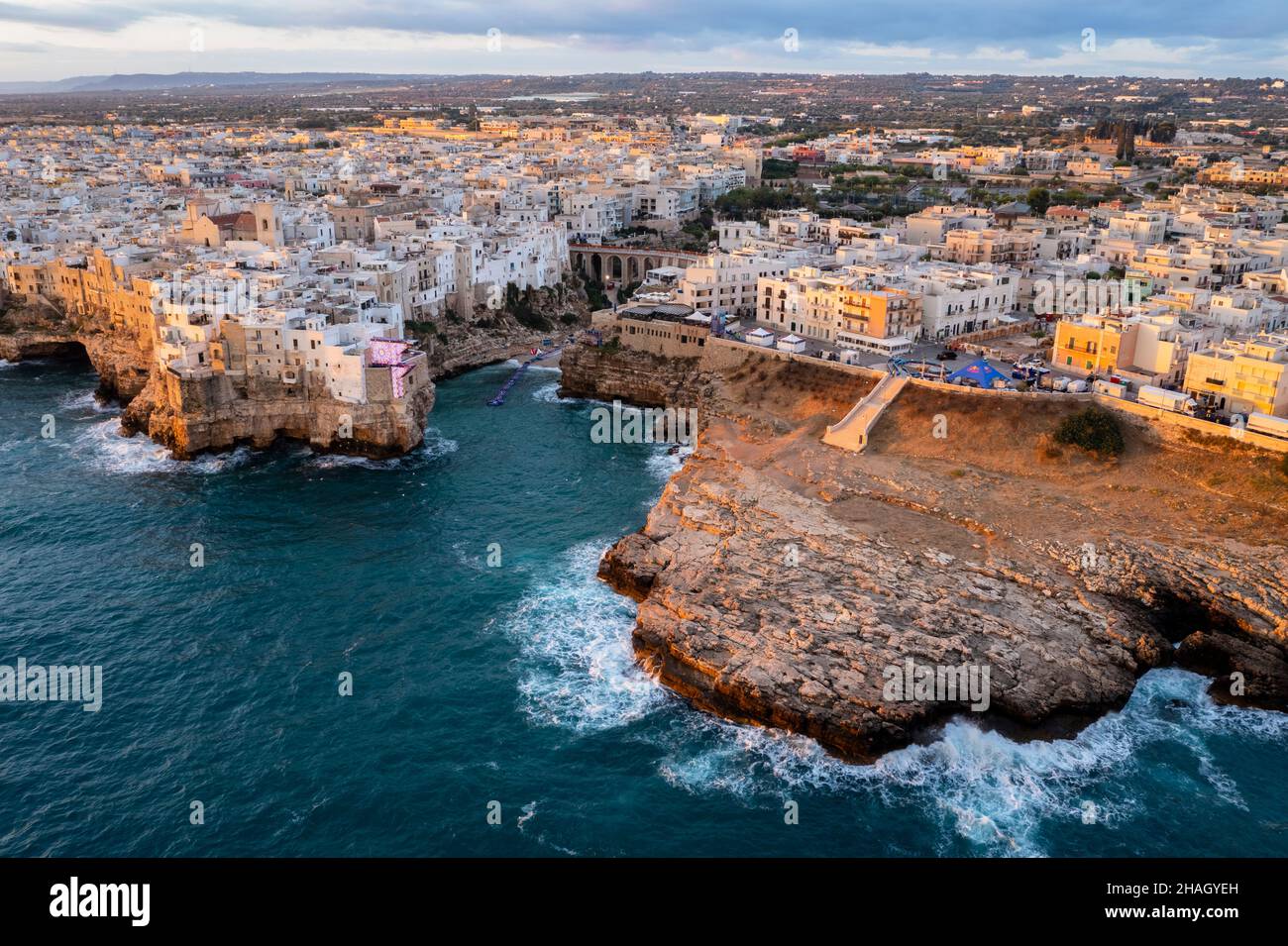 Aerial view of the overhanging houses of Polignano a Mare at sunrise. Bari district, Apulia, Italy, Europe. Stock Photo