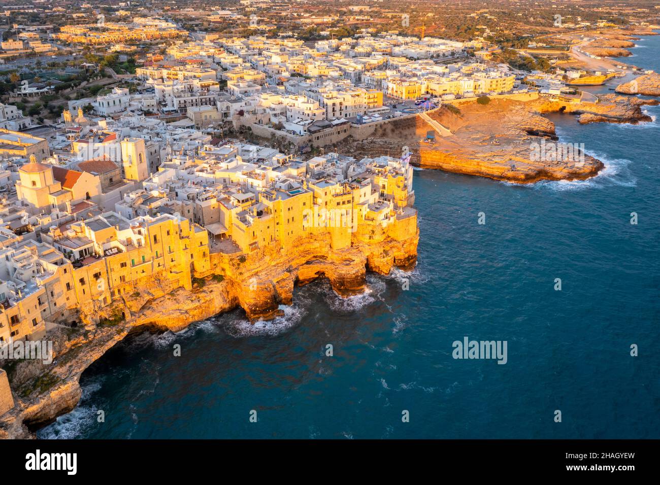 Aerial view of the overhanging houses of Polignano a Mare at sunrise. Bari district, Apulia, Italy, Europe. Stock Photo