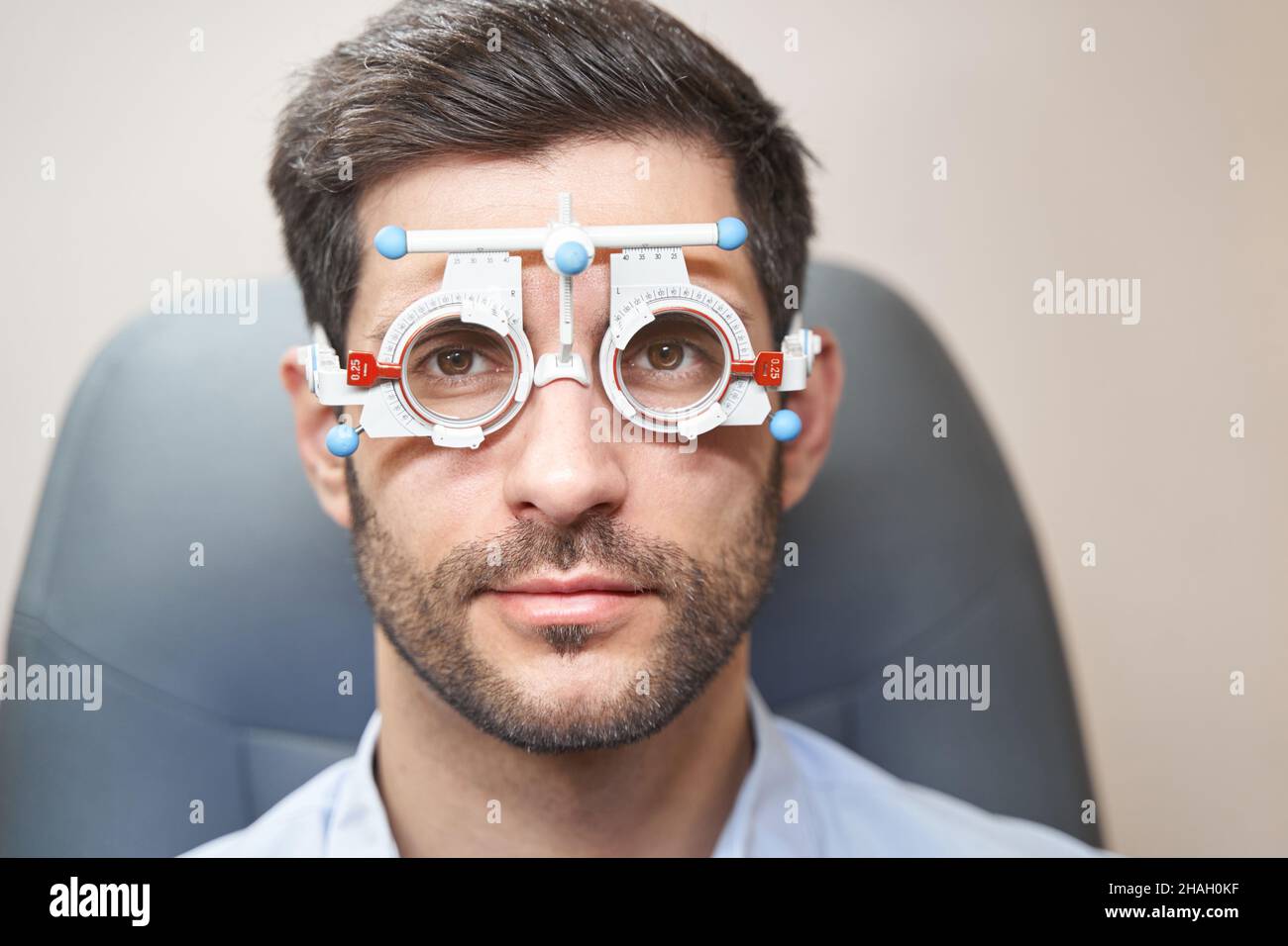Male in trial frame staring forward at camera Stock Photo
