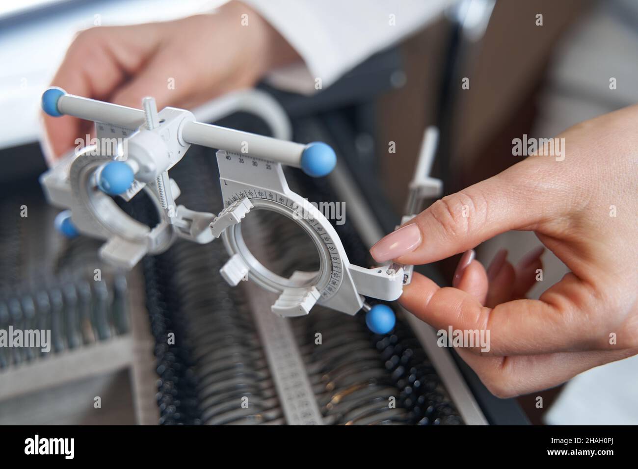 Person putting trial frame into box with lenses Stock Photo - Alamy