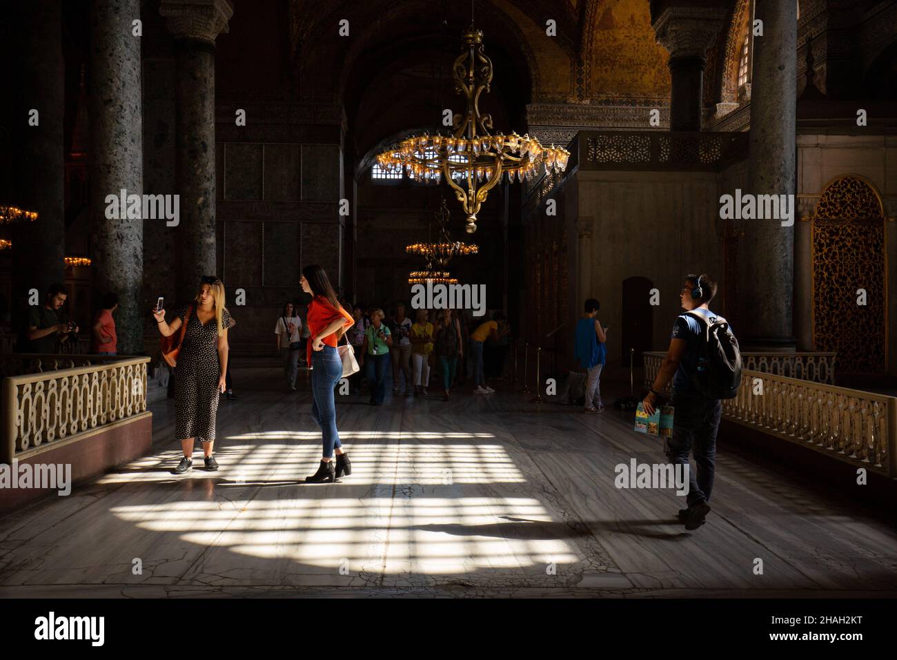 Tourist wanders inside the Hagia Sophia museum in Istanbul with admiration. Stock Photo