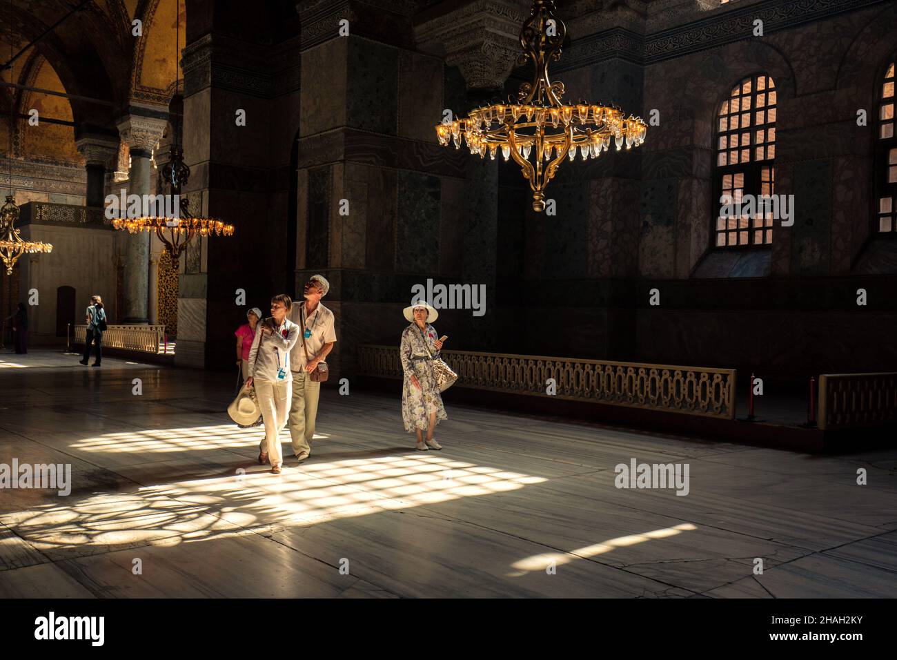 Tourist wanders inside the Hagia Sophia museum in Istanbul with admiration. Stock Photo