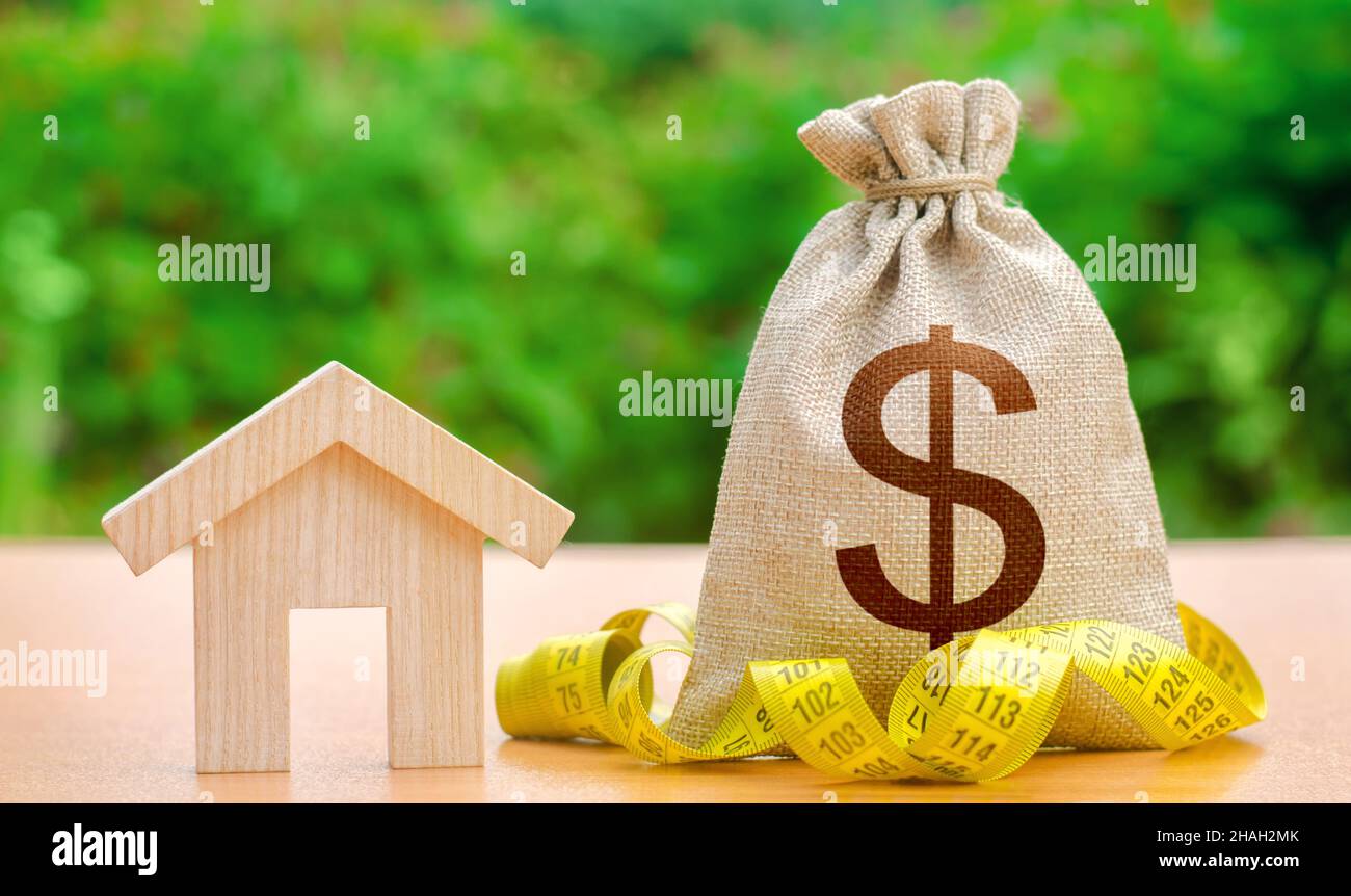 House and dollar money bag. Property valuation. Building maintenance