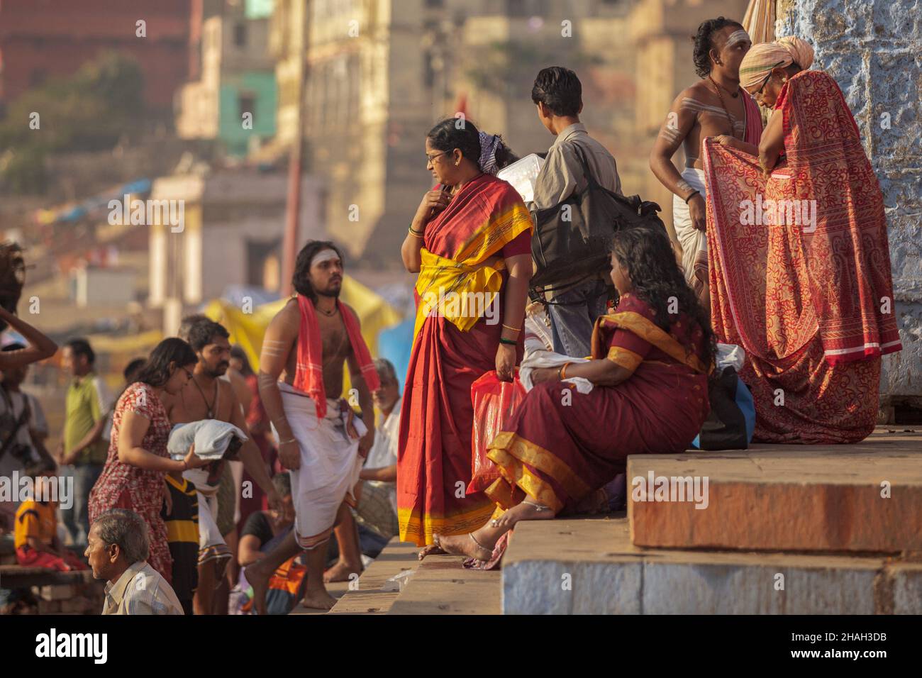 Pilgrims and sadhus at holy ghats in Varanasi, India Stock Photo