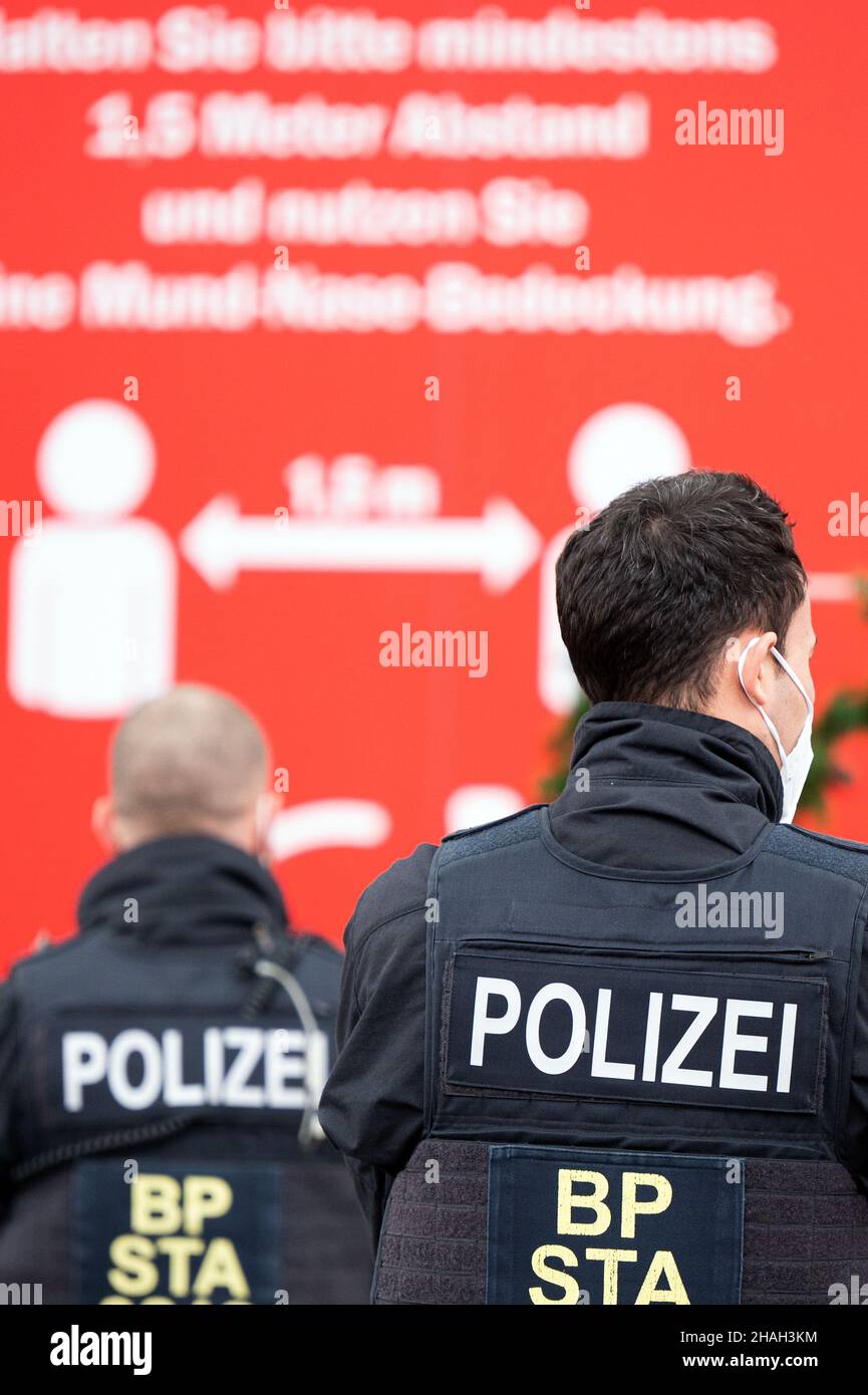 Cologne, Germany. 13th Dec, 2021. Police officers stand in a group in ...