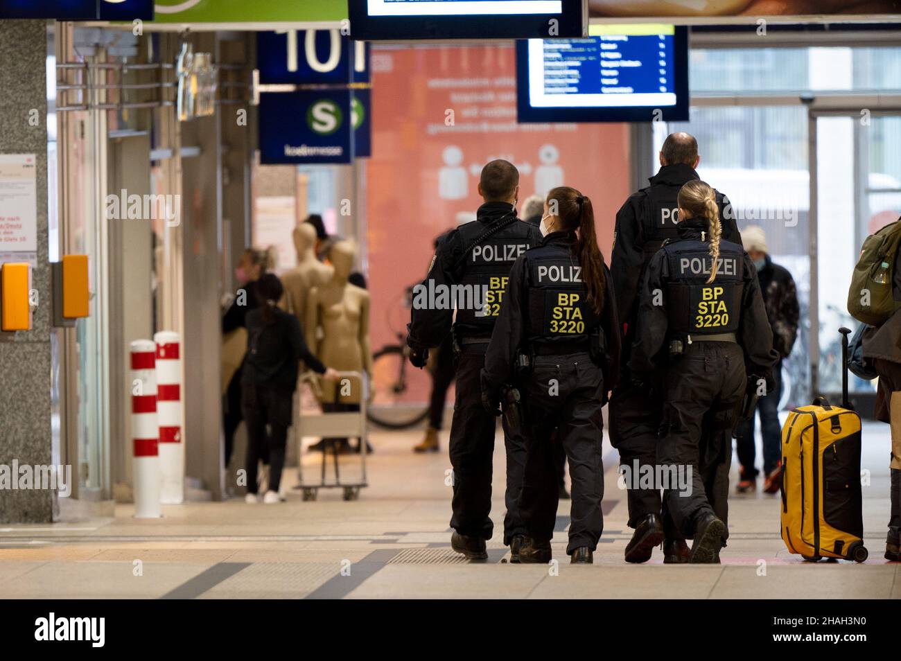 Cologne, Germany. 13th Dec, 2021. Police officers walk in a group ...