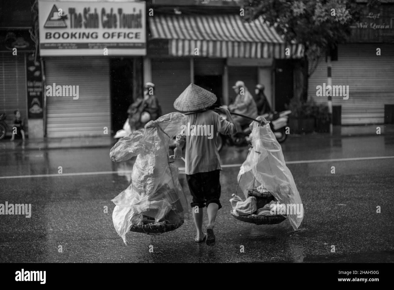 Street food   Street vendors in Hanoi are an idyllic, rustic beauty formed from the labor process of poor people. Behind those burdens is a story, an Stock Photo