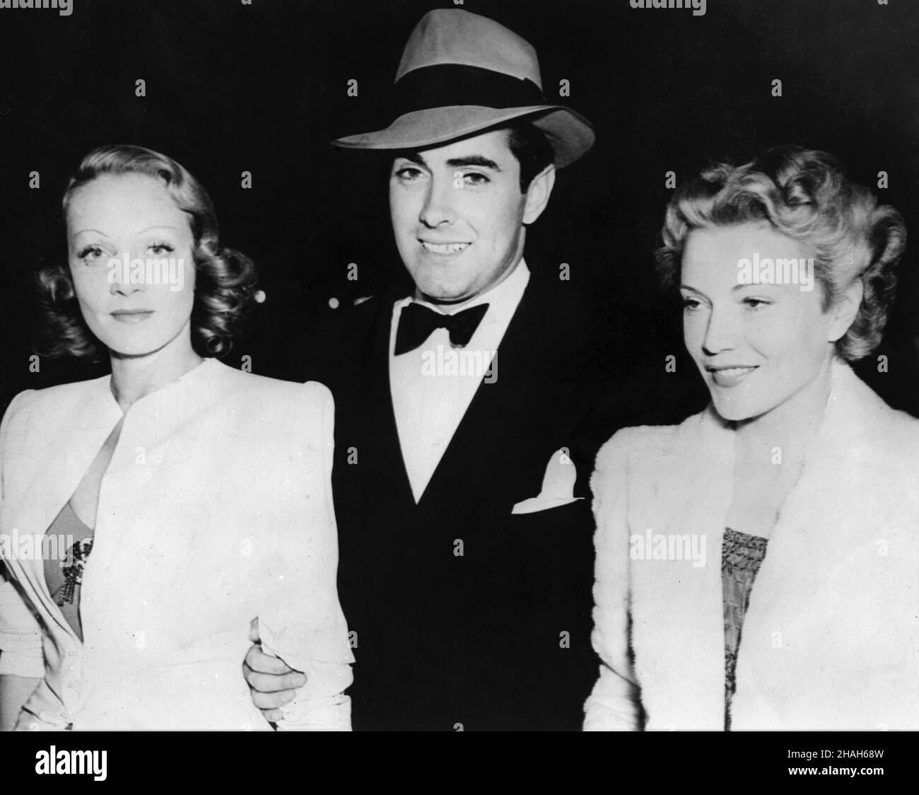 MARLENE DIETRICH with TYRONE POWER and French Actress ANNABELLA (shortly before their marriage) at the Hollywood premiere of  DEANNA DURBIN in THREE SMART GIRLS GROW UP at the Pantages Theatre  in Los Angeles in March 1939 Stock Photo