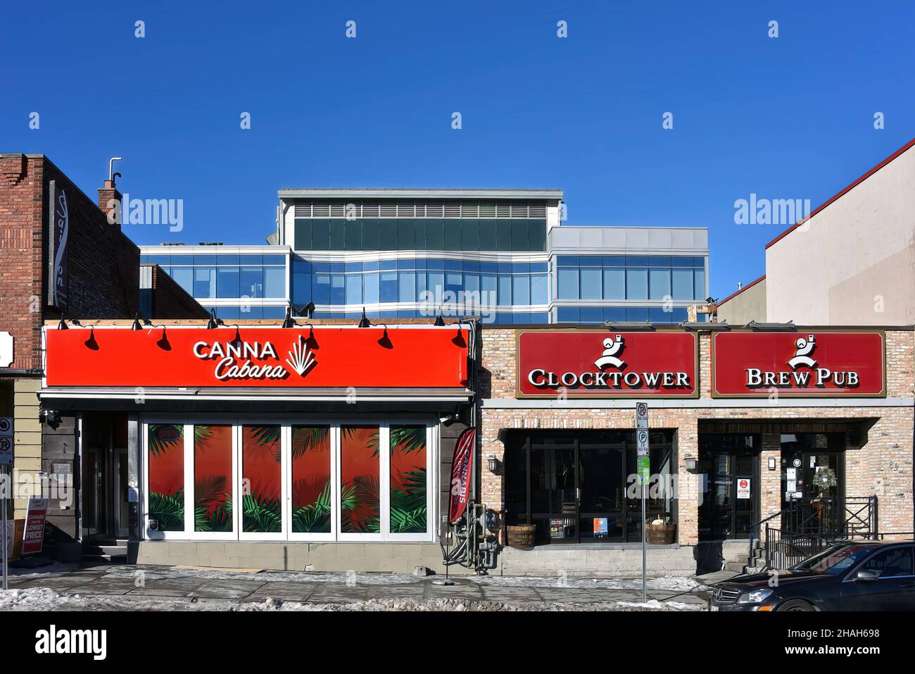 Ottawa, Canada - Dec 12, 2021: Canna Cannabis store and Clocktower Brew Pub on Clarence Street in the Byward Market, a popular tourist attraction. Stock Photo