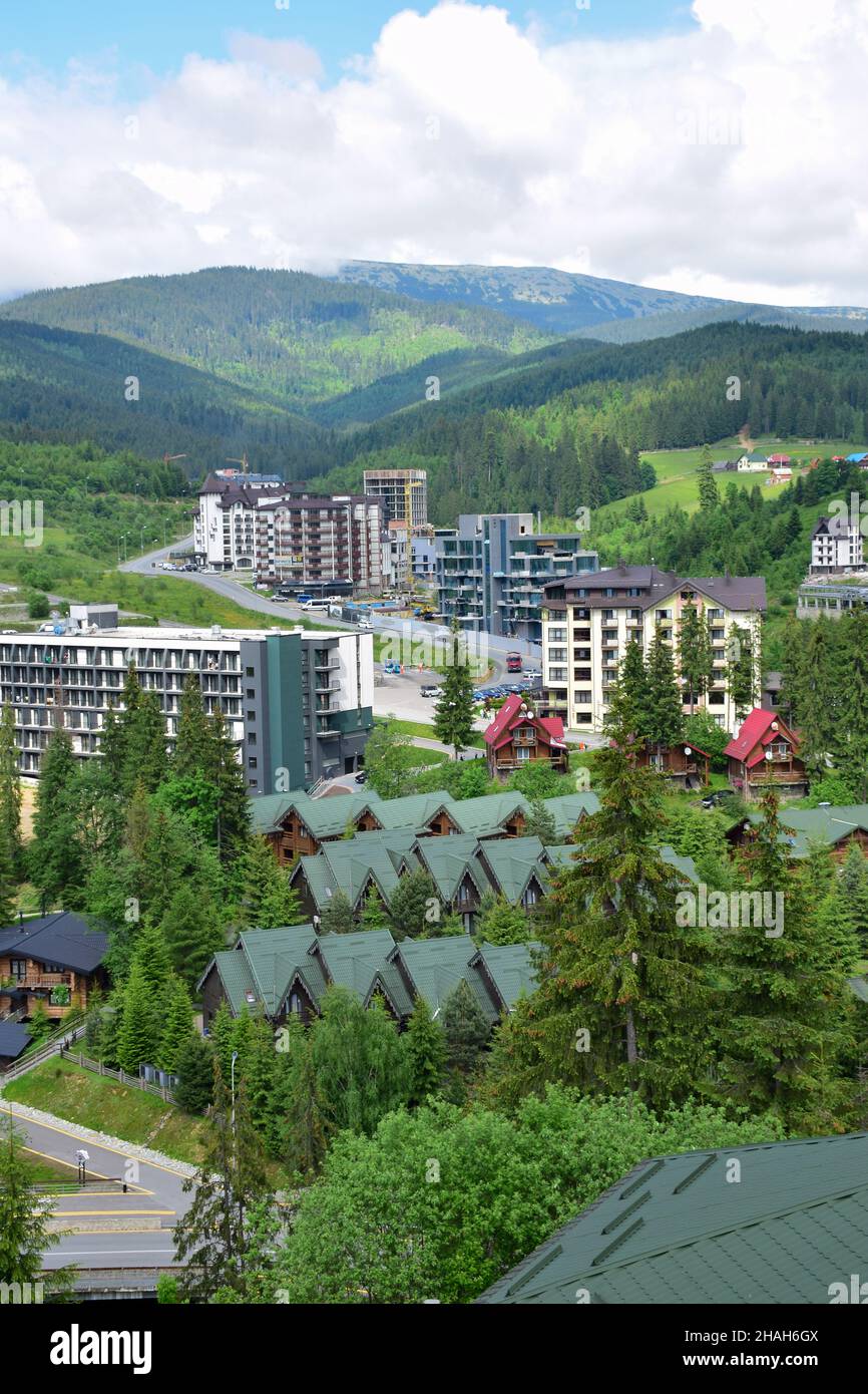 Ski resort in summer aerial view, in the background a lift to the mountainSki resort in summer aerial view, in the background a lift to the mountain. Stock Photo