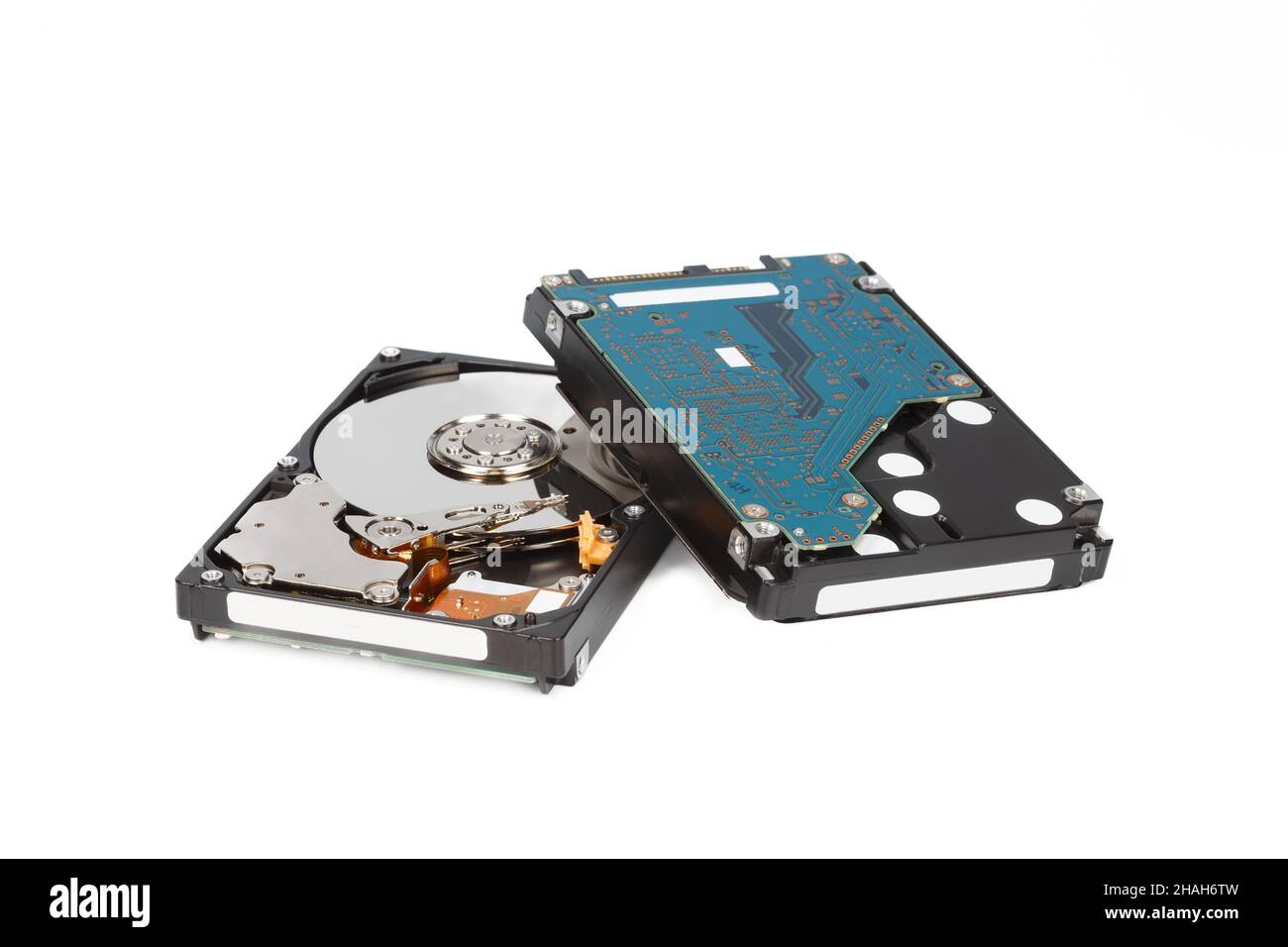 Two hard drives, front and back sides, on a white background close-up Stock Photo