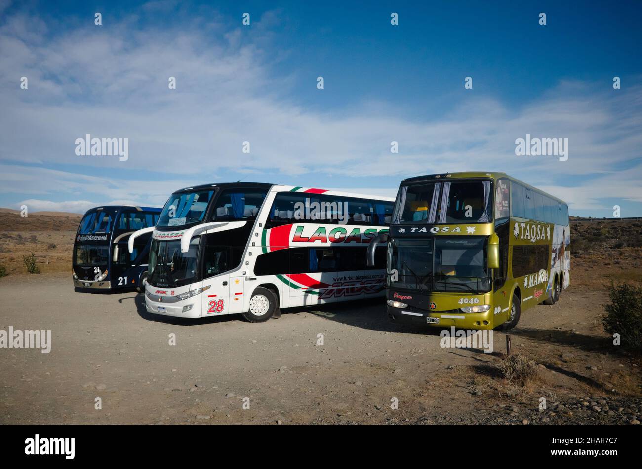 Santa Cruz, Argentina - March, 2020: Buses of different bus companies stopt on route between El Calafate to El Chalten. Bus passenger transportation Stock Photo