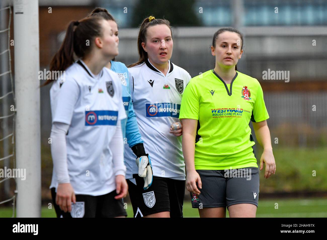 Neath, UK. 12th Dec, 2021. Alysha Hitchings of Merthyr Town Women and team mates mark Megan Kearle of Briton Ferry Llansawel Ladies during the Genero Adran South match between Briton Ferry Llansawel Ladies and Merthyr Town Women at Neath Sports Centre in Neath, Wales, UK on 12, December 2021. Credit: Duncan Thomas/Majestic Media. Credit: Majestic Media Ltd/Alamy Live News Stock Photo