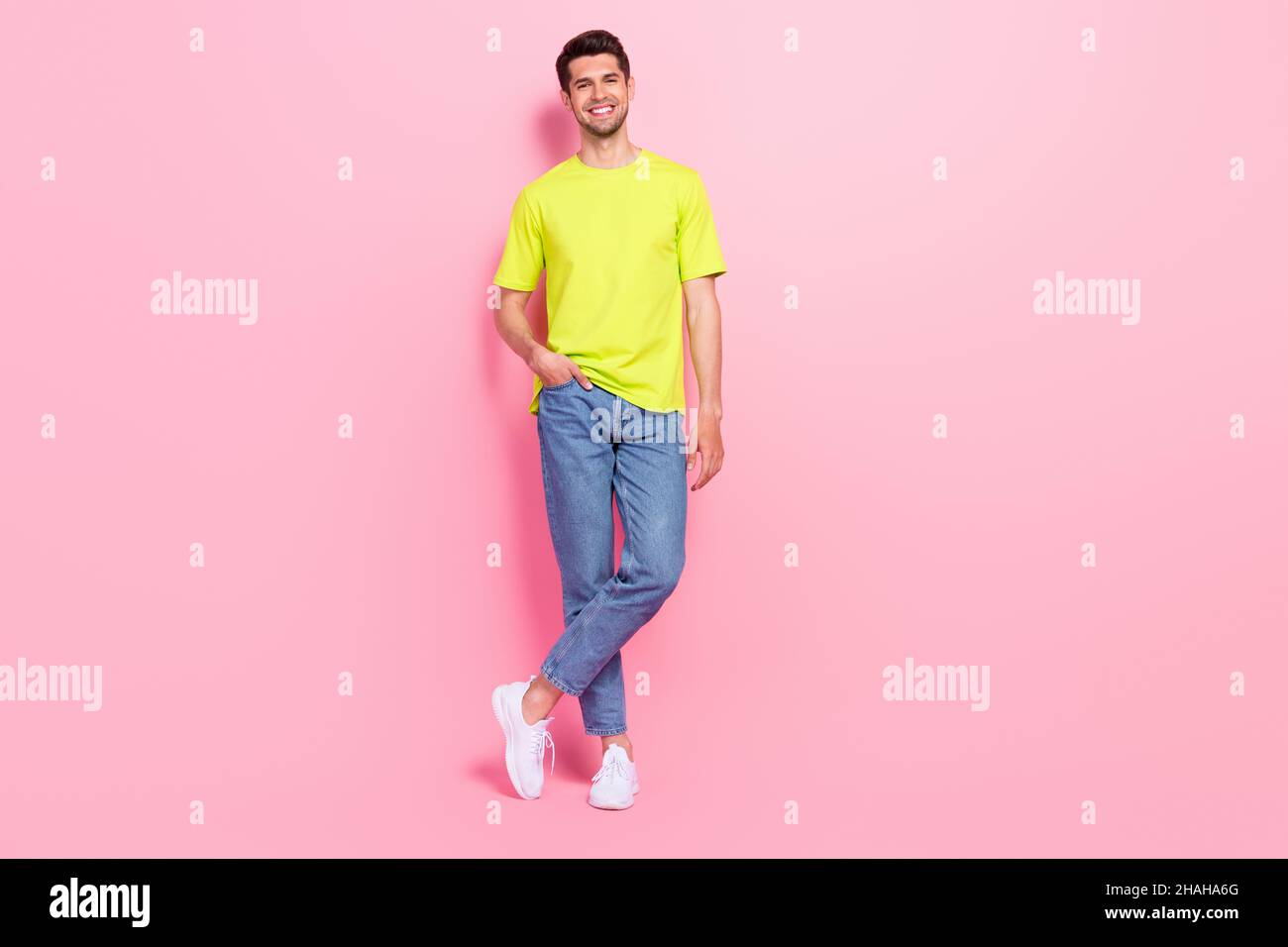 Full length body size photo man confident smiling in stylish outfit isolated pastel pink color background Stock Photo