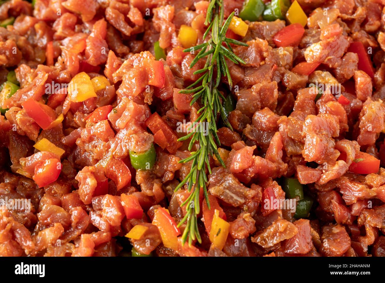 raw sauced diced meat on white wood background. Meat background. Meat close-up. Local name dana tantuni Stock Photo