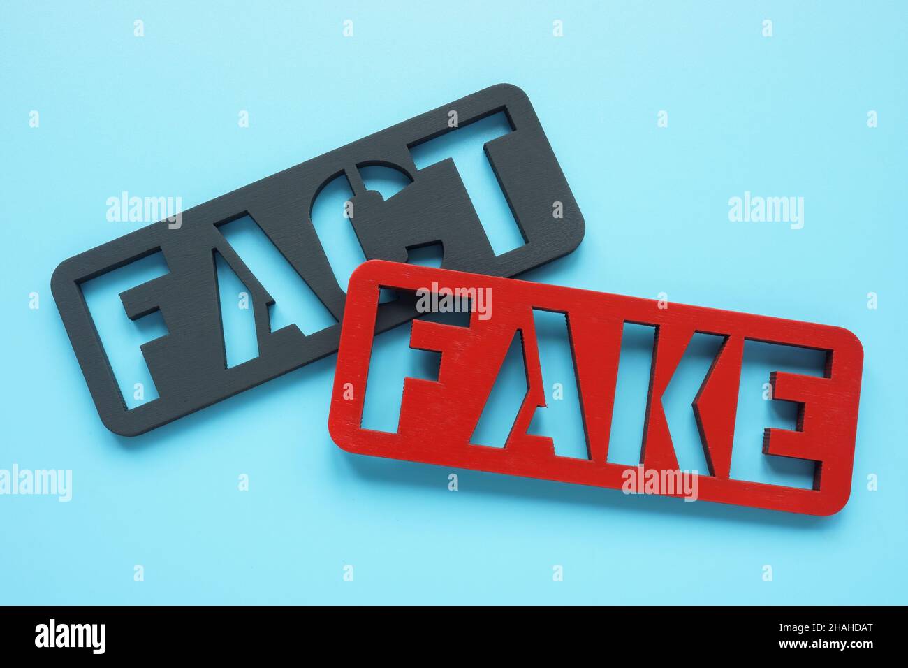 Plates Fact and Fake. Fake news concept. Stock Photo