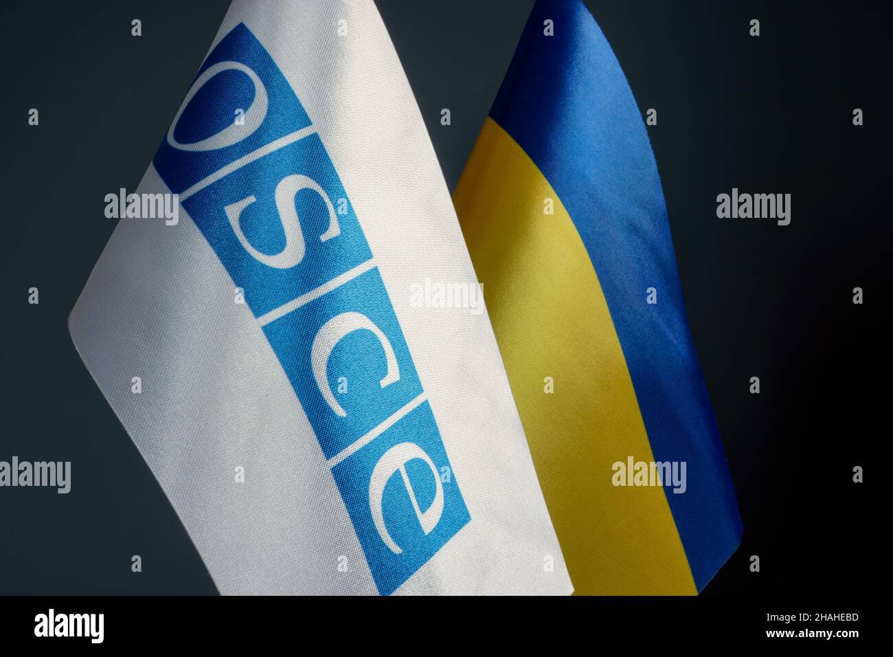 KYIV, UKRAINE - December 10, 2021. Flags of OSCE and Ukraine. Stock Photo