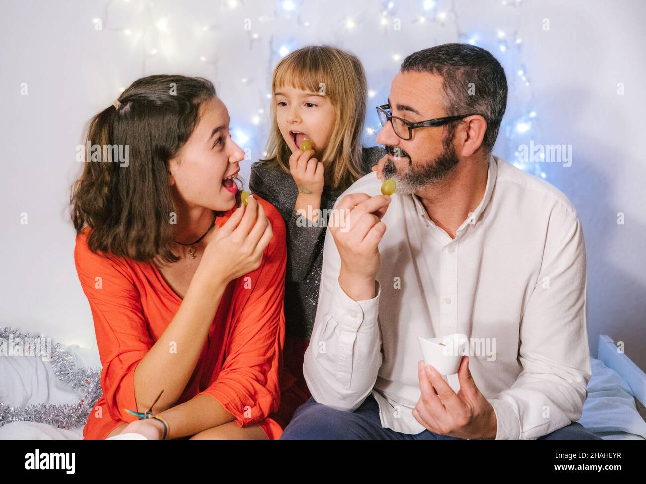 Celebration of New Year eating de twelve grapes. Spanish tradition Stock Photo