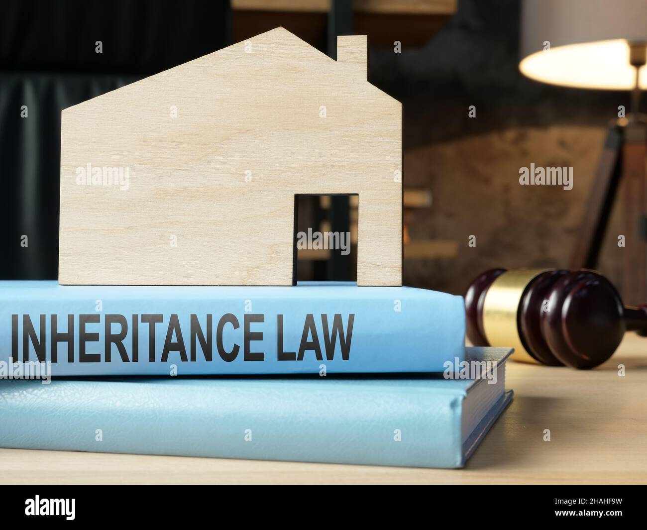 Inheritance law book and model of house. Stock Photo
