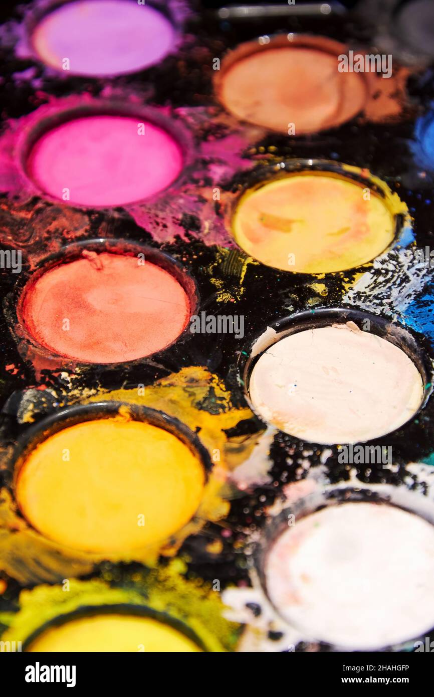 Vertical pallet with mixed bright paints. Splatters and messy colors ...