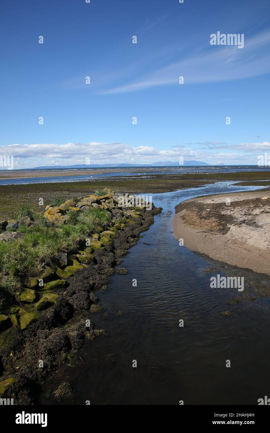 View west from Ayr across the Firth of Clyde towards the Isle of Arran Stock Photo