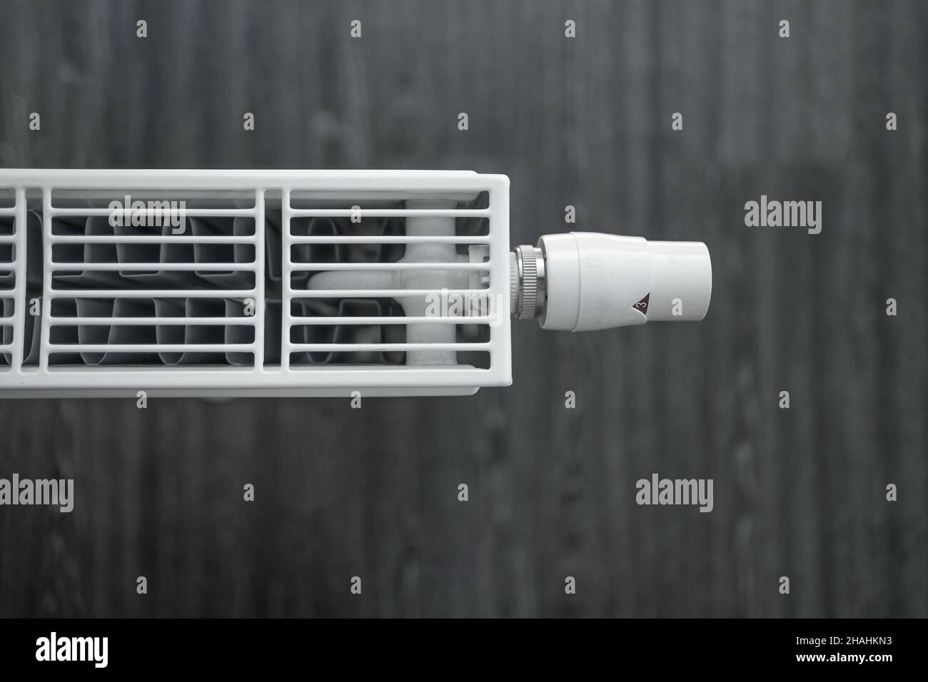 Adjusting thermostat radiator valve, closeup Stock Photo Alamy