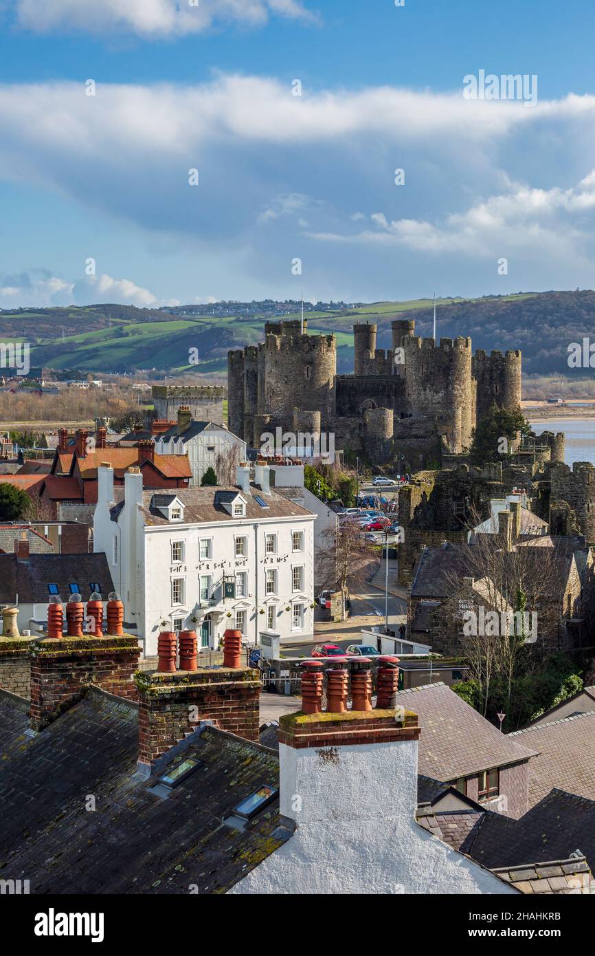 Conwy castle across the roof tops of the town, Wales Stock Photo