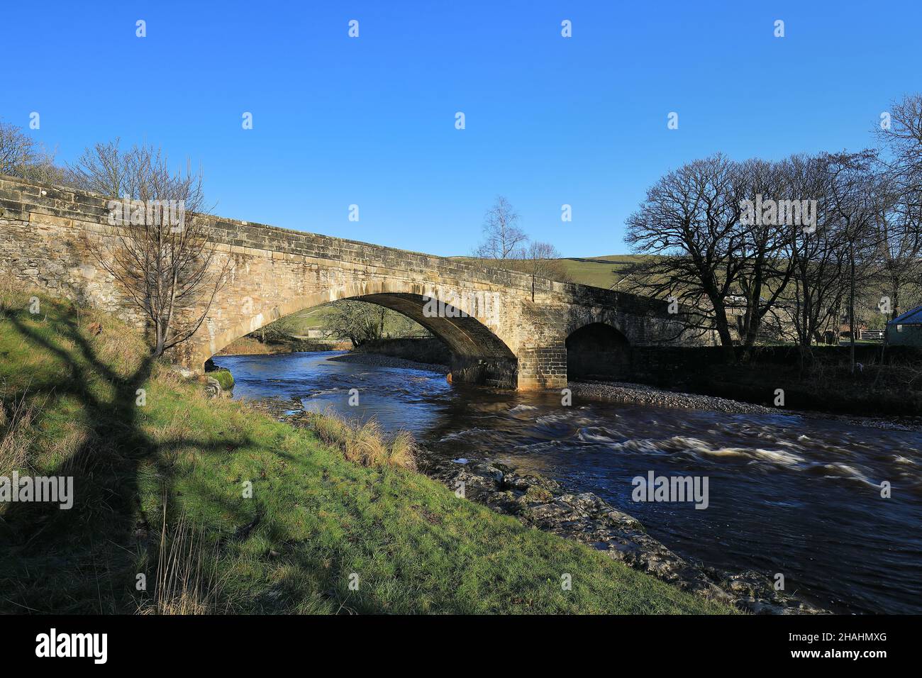 A stone bridge over the River Wharfe, at Kettlewell in Upper-Wharfedale, Yorkshire Dales National Park. Stock Photo