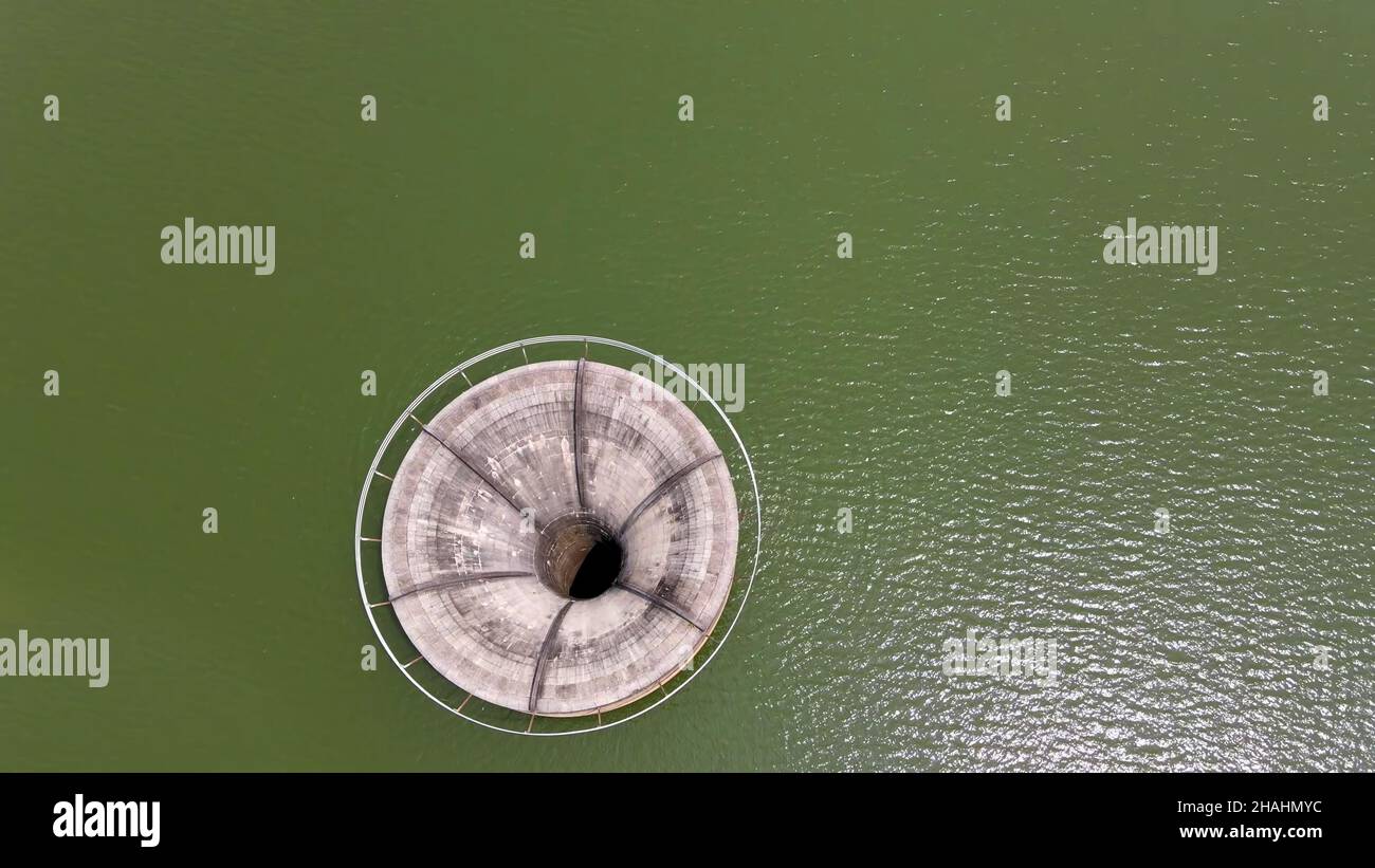 Bellmouth spillway in the water dam reservoir Stock Photo Alamy