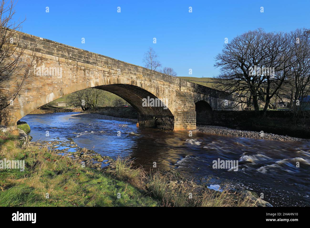 A stone bridge over the River Wharfe, at Kettlewell in Upper-Wharfedale, Yorkshire Dales National Park. Stock Photo