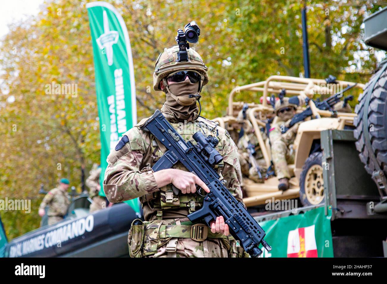 13 November 2021, London, UK - Lord Mayor's Show, Marine with automatic gun, helmet and camera at Royal Marines Reserve float Stock Photo