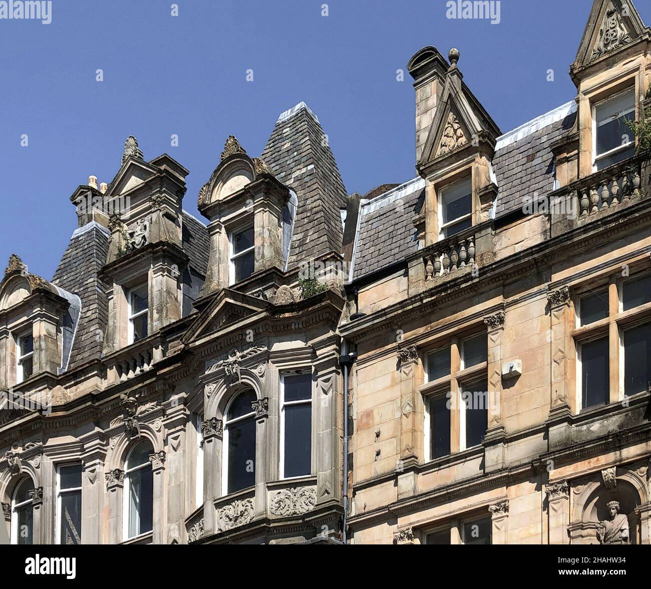 Upper row of flats on High Street in Paisley, Scotland Stock Photo Alamy