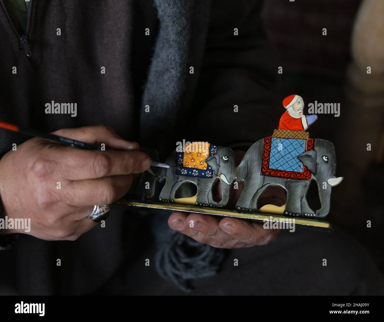 Srinagar, India. 13th Dec, 2021. Kashmiri artisan giving finishing