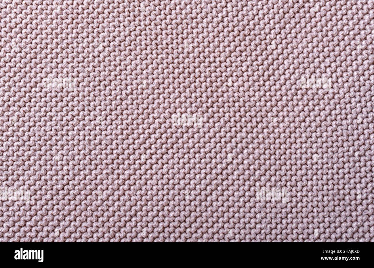 Knitted fabric texture. The pattern is clearly visible. Stock Photo