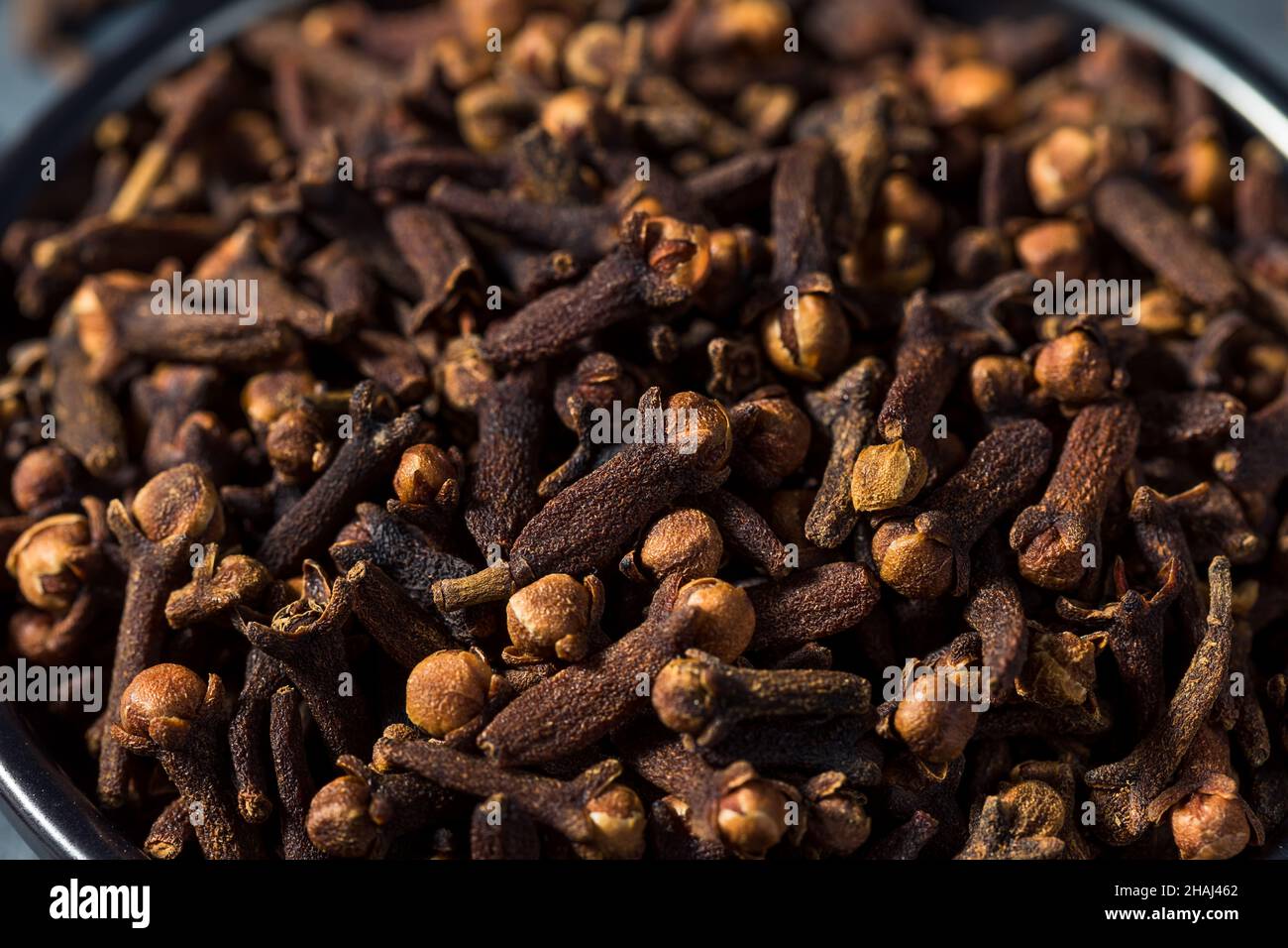 Dry Organic Whole Cloves in a Bowl Stock Photo