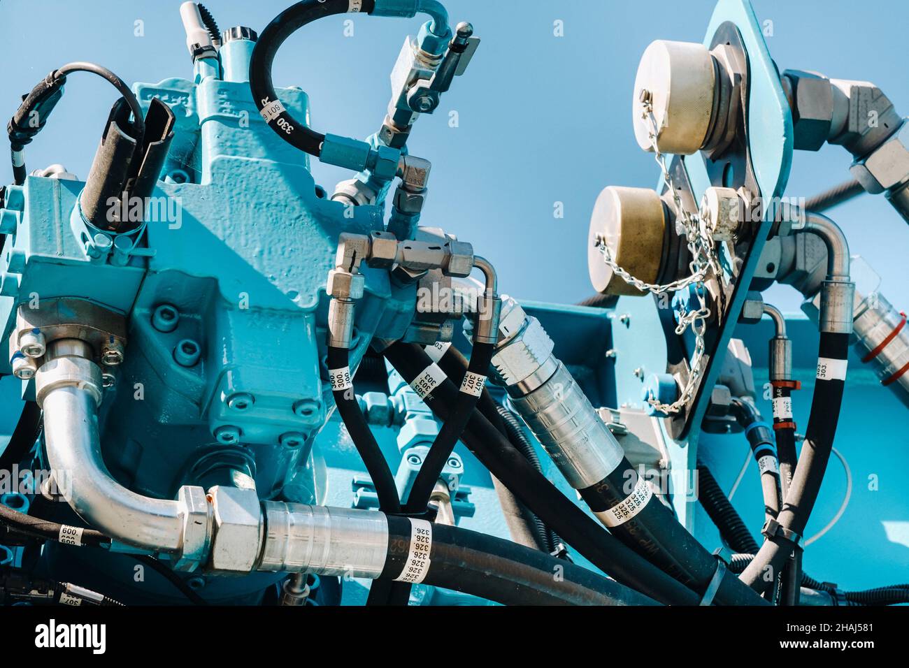 There are many hydraulic hoses and a hydraulic crane lifting control