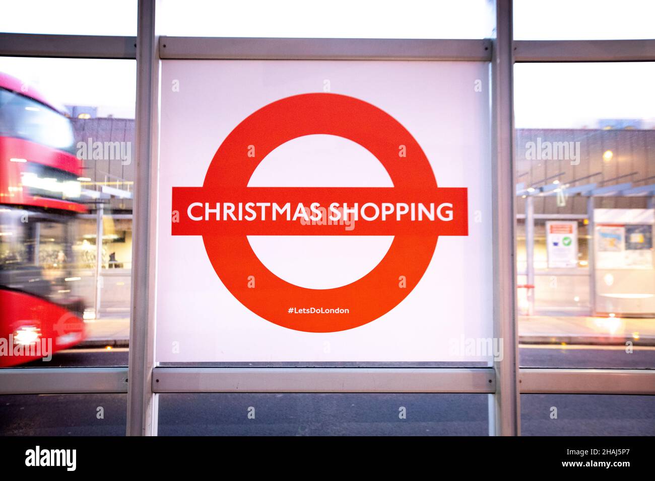 A special 'Christmas Shopping' roundel goes up at London Bridge bus station. Stock Photo