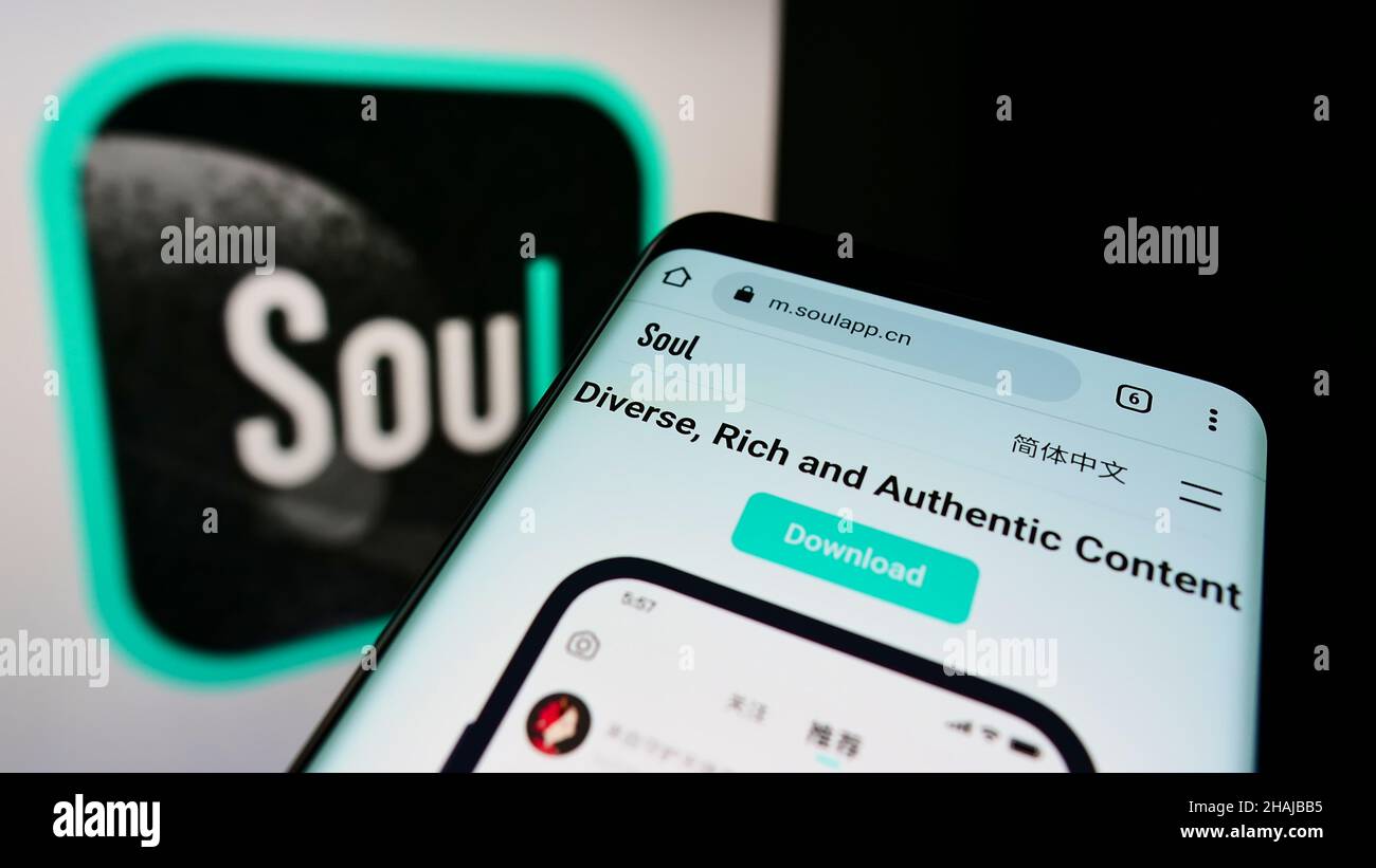 Mobile phone with webpage of Chinese social network company Soulgate Inc. (Soul) on screen in front of logo. Focus on top-left of phone display. Stock Photo