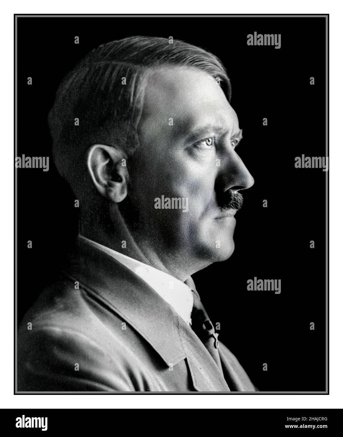 ADOLF HITLER PORTRAIT PROFILE 1930's B&W studio posed low key head and shoulder official portrait photograph of Adolf Hitler in uniform, by Heinrich Hoffman Hitler's personal photographer used most notably on Nazi Germany postage stamps Stock Photo